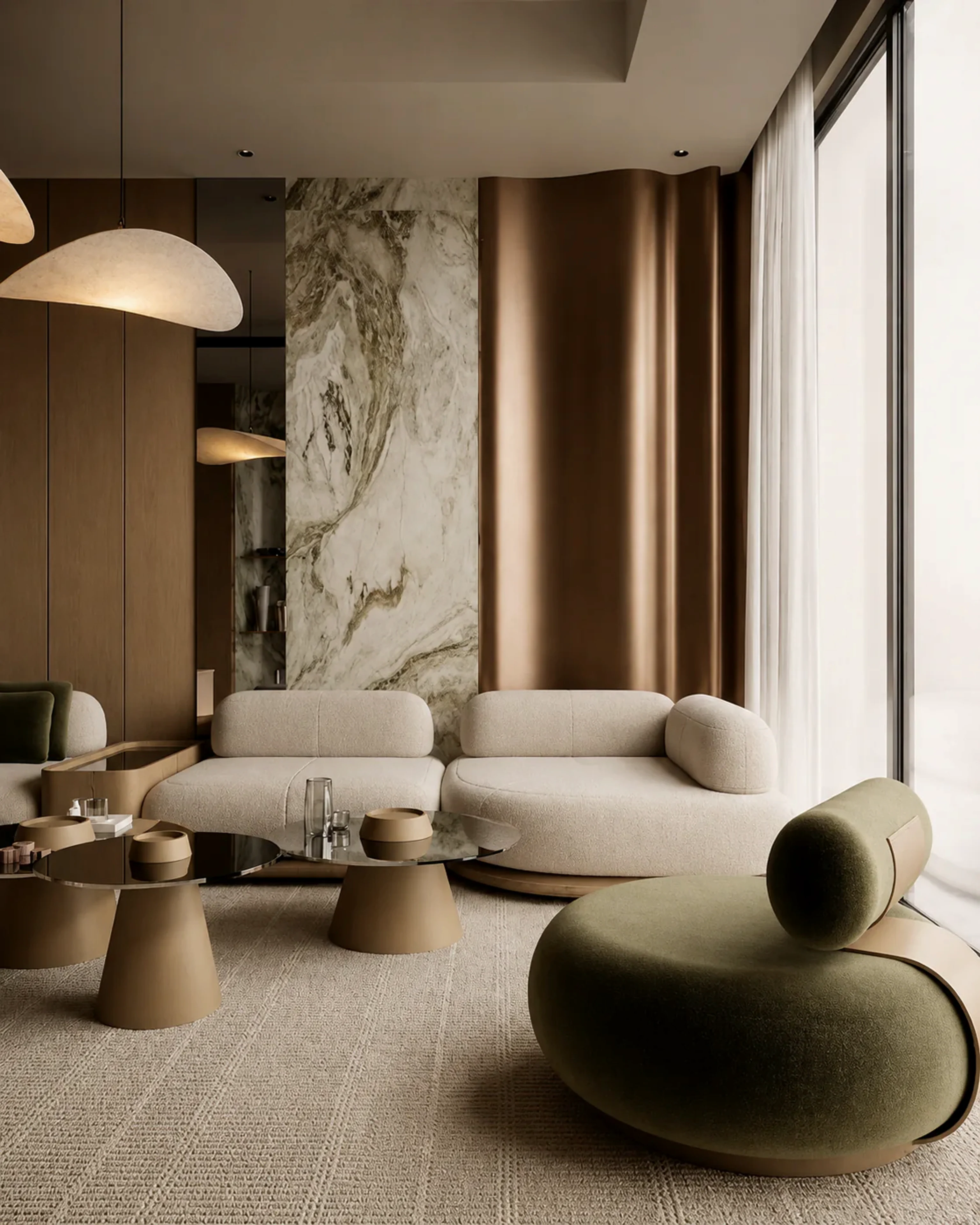 Stillstone lounge with curved sofa, marble wall, bronze-toned panel, and natural light