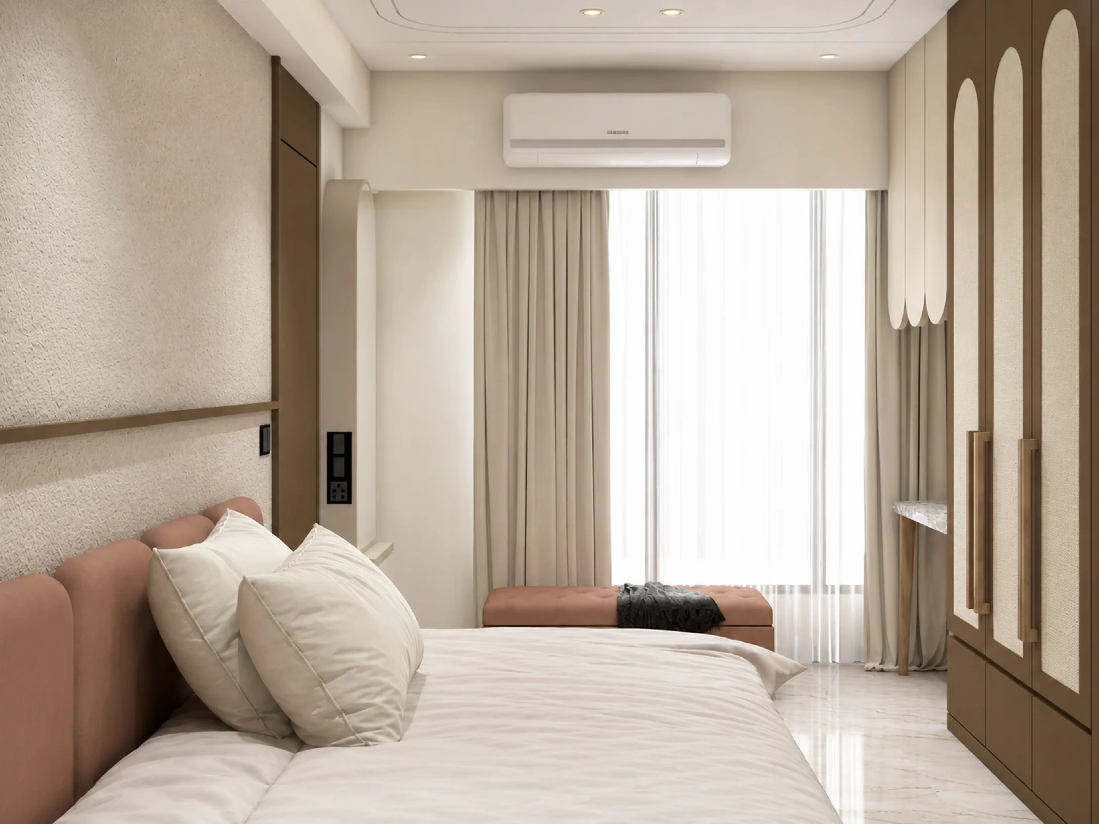 Veda residence bedroom with a soft pink upholstered headboard, textured wardrobe panels, and warm natural light